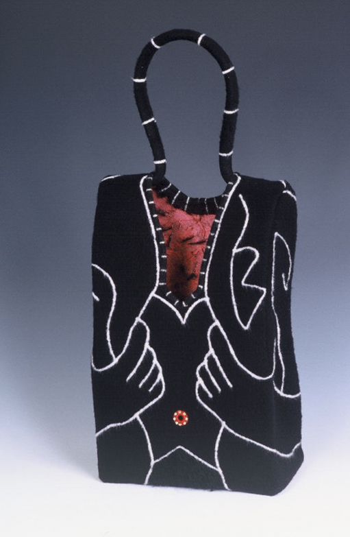 Reveal Handbag, 1999, 9”x 5”x 24”, wool, fulled, polymer, reed.