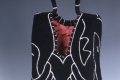 Reveal Handbag, 1999, 9”x 5”x 24”, wool, fulled, polymer, reed.